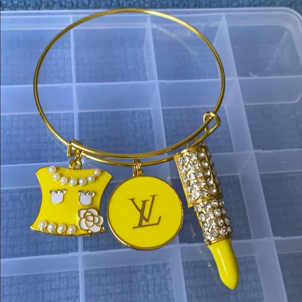 Gold plated bangle with charms
